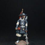 Ashigaru Une figurine d’Okko Chronicles, Ashigaru, soldat équipé d’une lance.