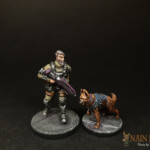 Le Chasseur de primes Duo de figurines de Nemesis, Le Chasseur de primes et son chien, personnage barbu et armé.