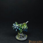 Oeuf d'intrus Une figurine de Nemesis, Oeuf d’intrus, deux boules bleu parsemés de liquide vert.