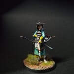 Genji Archer tenant son arme dans les main avec une flèche encoché. Il porte un chapeau et un kimono bleu turquoise